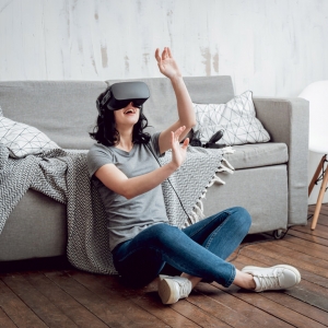 The beautifull girl wearing virtual reality goggles